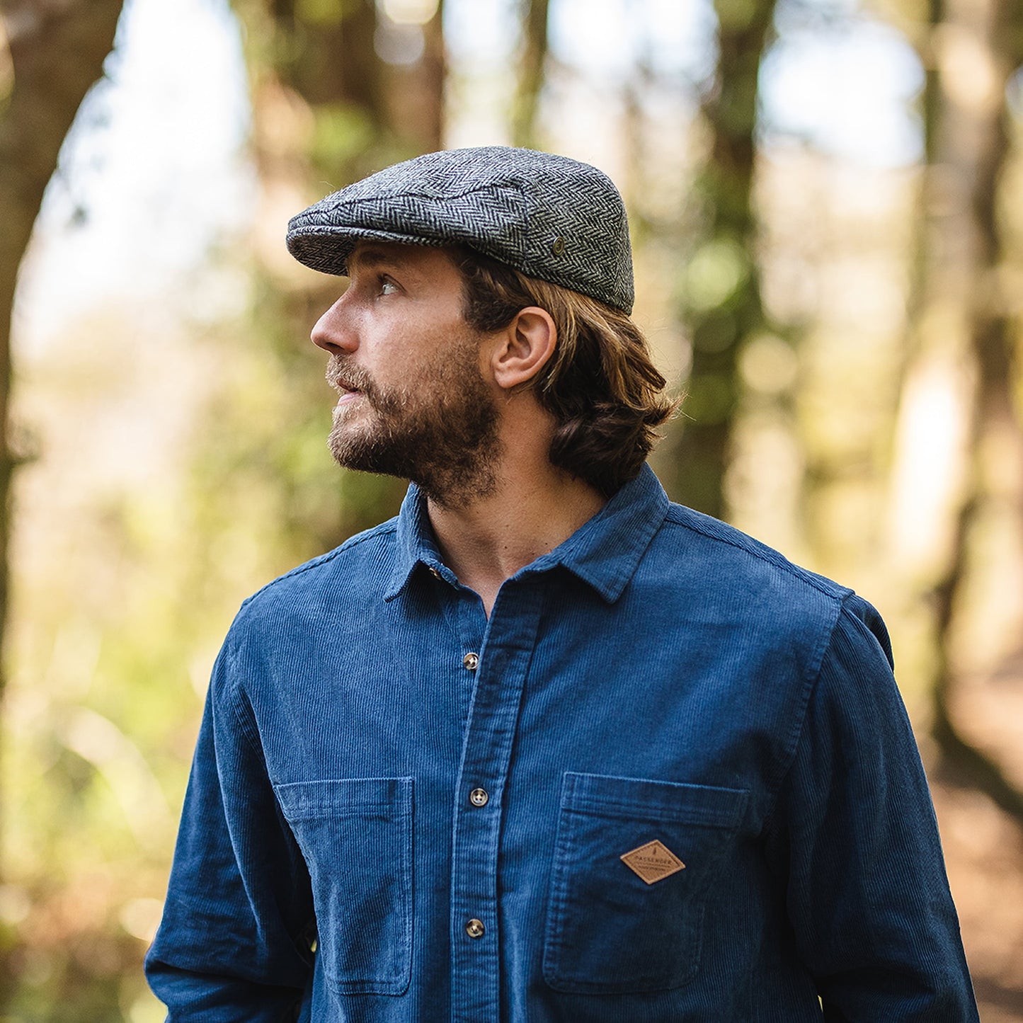 Gorra plana Kinloch de HARRIS TWEED diseño de espiga de Jaxon & James - Negro-Gris