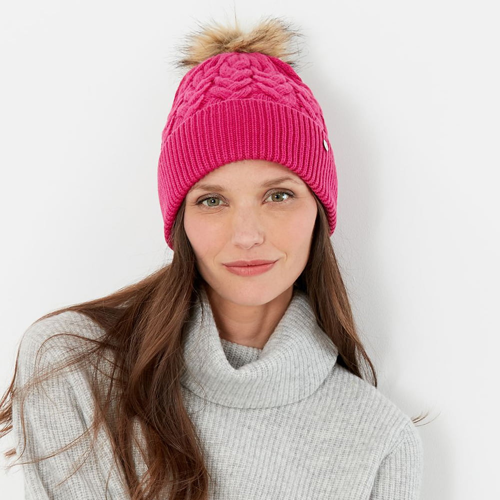 Gorro con pompón Elena punto de cable Pompón de piel sintética de Joules - Rosa